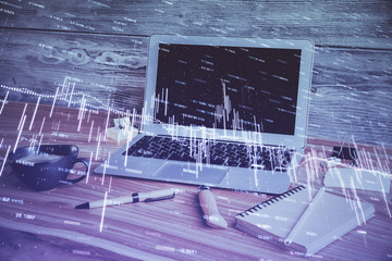 Double exposure of forex chart and work space with computer. Concept of international online trading.