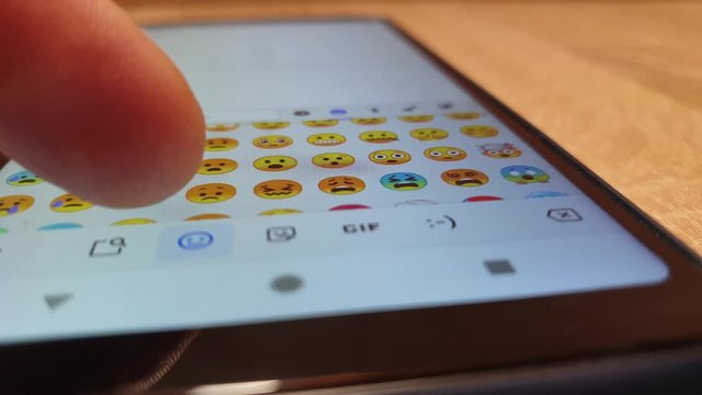 Choose emoticons on your smartphone. Emoticons chatting.