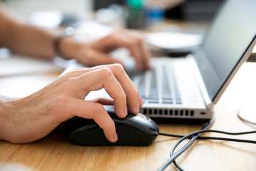 hand using computer in desk