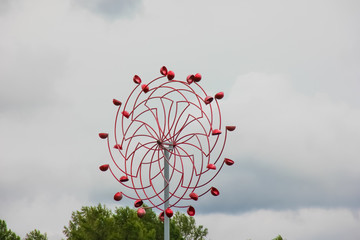 Meterological weather station wind meter anemometer on sky background. Big and colorful scientific...