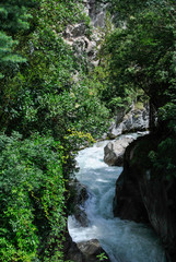 Fototapeta na wymiar detail of a mountain river with white fast water