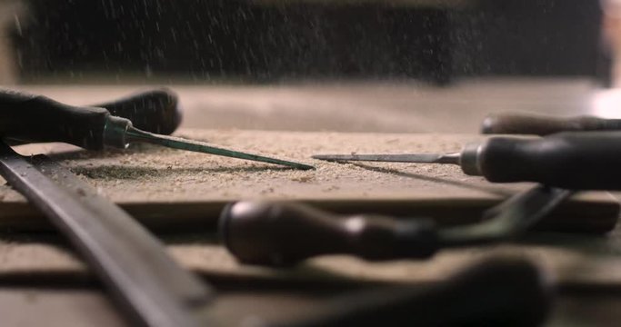 Draw Knives And Chisels On A Saw Dust Filled Wood Board In A Wood Working Studio In Ontario, Canada - Extreme Close Up 4k 60p