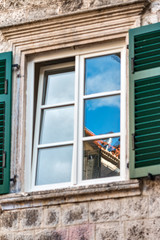 Windows with shutters. Cityscape of the old town.