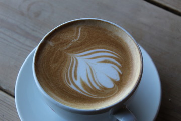 Early morning, cup of coffee, sea front.