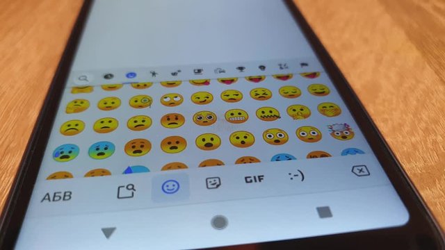 Choose emoticons on your smartphone. Emoticons chatting.
