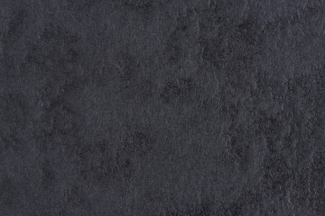 Black paper with abstract texture for background. Paper for interior and exterior decoration or background for handcrafts. Black paper background.