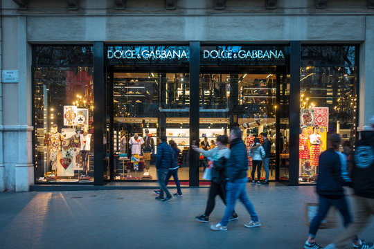 Barcelona, Spain. March 2018: People walking in front of Dolce Gabbana shop