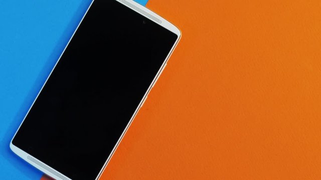 Smartphone B-roll video  on a colorful background. 2 horizontal trucking shot clips