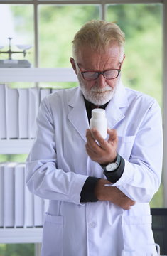 Senior male researcher carrying out scientific research in a lab