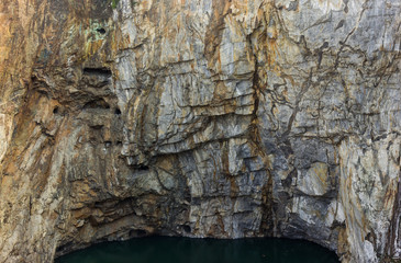 Rock texture and surface background. Cracked and weathered natural stone background.