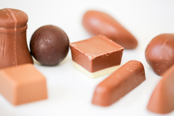 Yummy chocolate candies on white background - Image