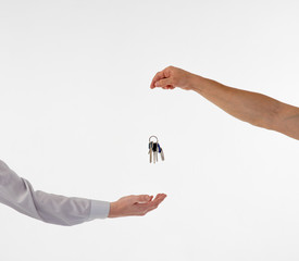 hand passes the keys to another person. Keys in hand, isolate the trust, the transaction