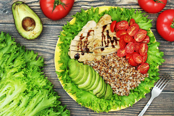 Turkey breast, avocado, salad and buckwheat as healthy lunch	