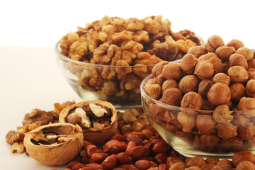 Different nuts in glass cups