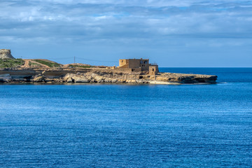 Fototapeta premium The Il-Qolla I-Badja battery near Marsalforn, Gozo, Malta, Europe