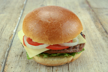 beef burger on a wood table