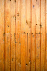 Background of wooden boards painted with stain in yellow.