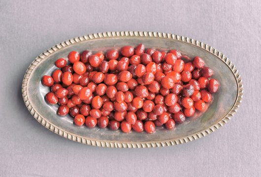 Overhead View Of A Tray Of Cranberries In An Antique Silver Tray With Vintage Analog Filter. 