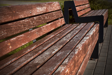 Fototapeta na wymiar background wooden bench on the street with perspective and blur