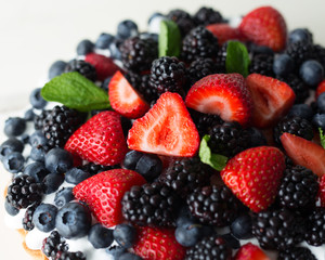 Close up of a strawberry, blackberry and blueberry pie. 