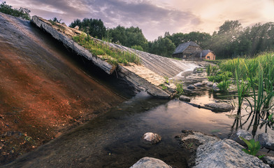 Fototapeta premium old water mill over the river