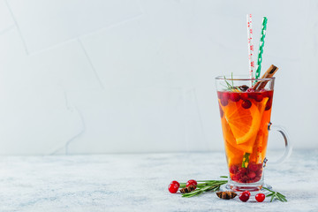 Orange and cranberry drinks with orange slices and spices. Hot drinks for winter and Christmas