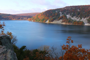 Beautiful Wisconsin ice age nature background. Scenic autumn landscape with blue lake from West Bluff rocky hiking trail at Devils Lake State Park, Baraboo area, Wisconsin, Midwest USA.