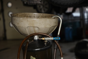 oil change in a car in a private garage