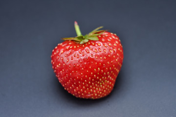 Strawberry close-up on a black background, strawberry macro