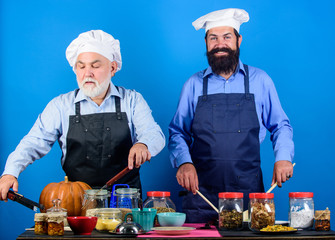 Say no to unhealthy food. cereals and seasoning. professional restaurant cook. mature senior bearded men in kitchen. Chef men cooking. men prepare food. Healthy food cooking. Halloween pumpkin recipe