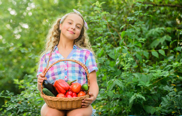feels hunger. kid on summer farm. Organic food. healthy food for children. happy little farmer. autumn harvest. harvest vitamin. spring market garden. little girl vegetable in basket. Only natural