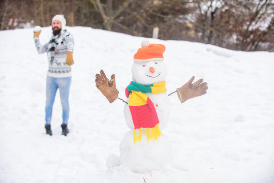 I Cant Believe In It. Man Play With Snow. Winter Season Activity. Its Christmas. Bearded Man Build Snowman. Winter Holiday Outdoor. Warm Sweater In Cold Weather. Happy Hipster Ready To Celebrate Xmas