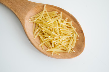 vermicelli grains in wooden spoon