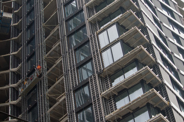 Construction of a multi-storey building right by the sea - photo taken in autumn