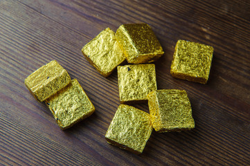 Chinese tea in gold packaging on a wooden table