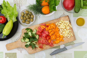 Cooking, cutting fresh vegetables on cutting board. Ingredients for cooking vegetarian, diet food
