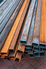 Steel bar for construction.Metal pipe profile. Stock photo of metal beams.