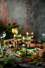 vintage wine glasses with champagne on old wooden green tray