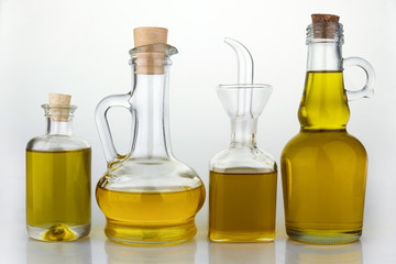 Set of virgin olive oil jars on a white background