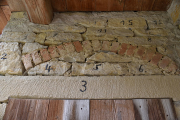Painted Numbers on Old Rough Stone Wall 6905-042