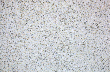 Texture of a concrete wall with cracks and scratches which can be used as a background