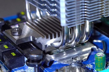 CPU cooling system. Cooler with radiator on the motherboard.