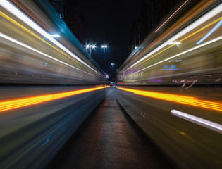 Fototapeta na wymiar Trams Passing by at night