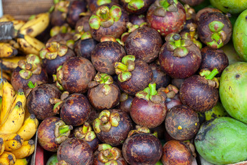 Pile of mangosteen, the queen of fruits. Those fruits are found all over South East Asia and are juicy and delicious.