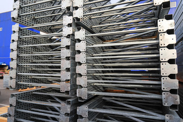 Gray big metal mobile shelving stacked in a warehouse of a construction shopping center. Shelves for placement and storage of goods in building materials stores