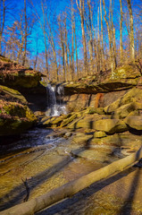A small waterfall in the autumn in the forest in the parkon Brandywine Creek in Cuyahoga Valley National Park, Ohio.