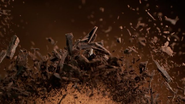 Super slow motion of flying group of raw chocolate shavings. Filmed on high speed cinema camera, 1000fps.