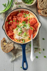 Spicy shakshuka with eggs, tomatoes and herbs