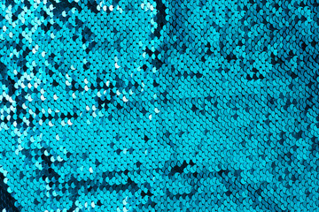 Macro sequins blue glitter wave background texture