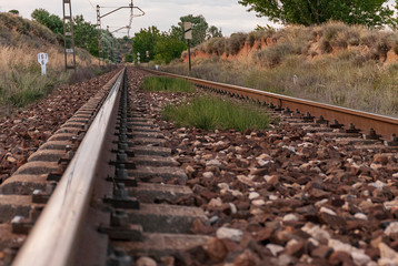 Fototapeta na wymiar Unique railroad line at the sunset. Train railway track . Low clouds over the railroad.